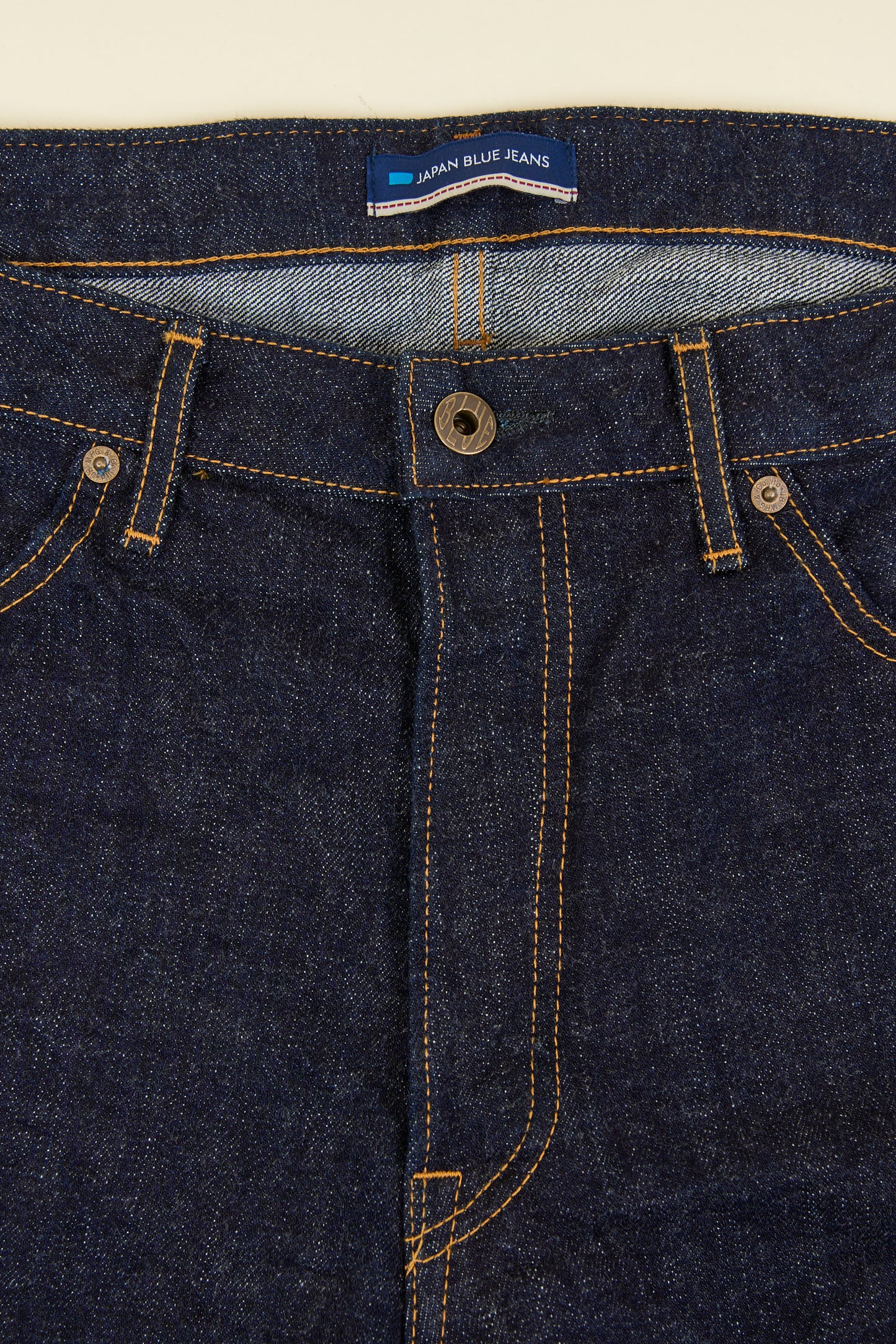 Japan Blue J427 Selvedge Jeans – button fly close-up with copper hardware detail.
